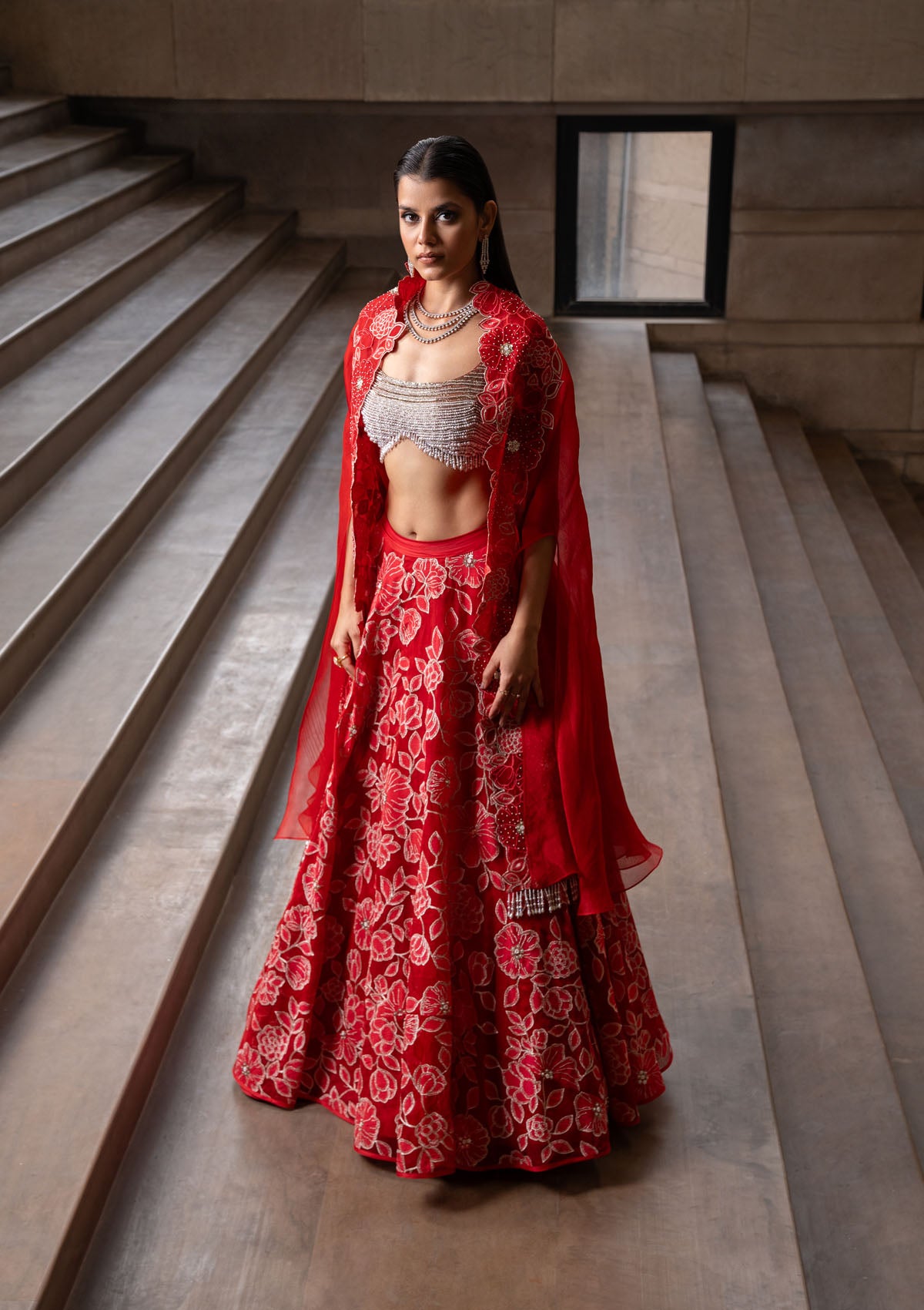 Simran Sethi in Crimson Jaal Cape and Lehenga Set
