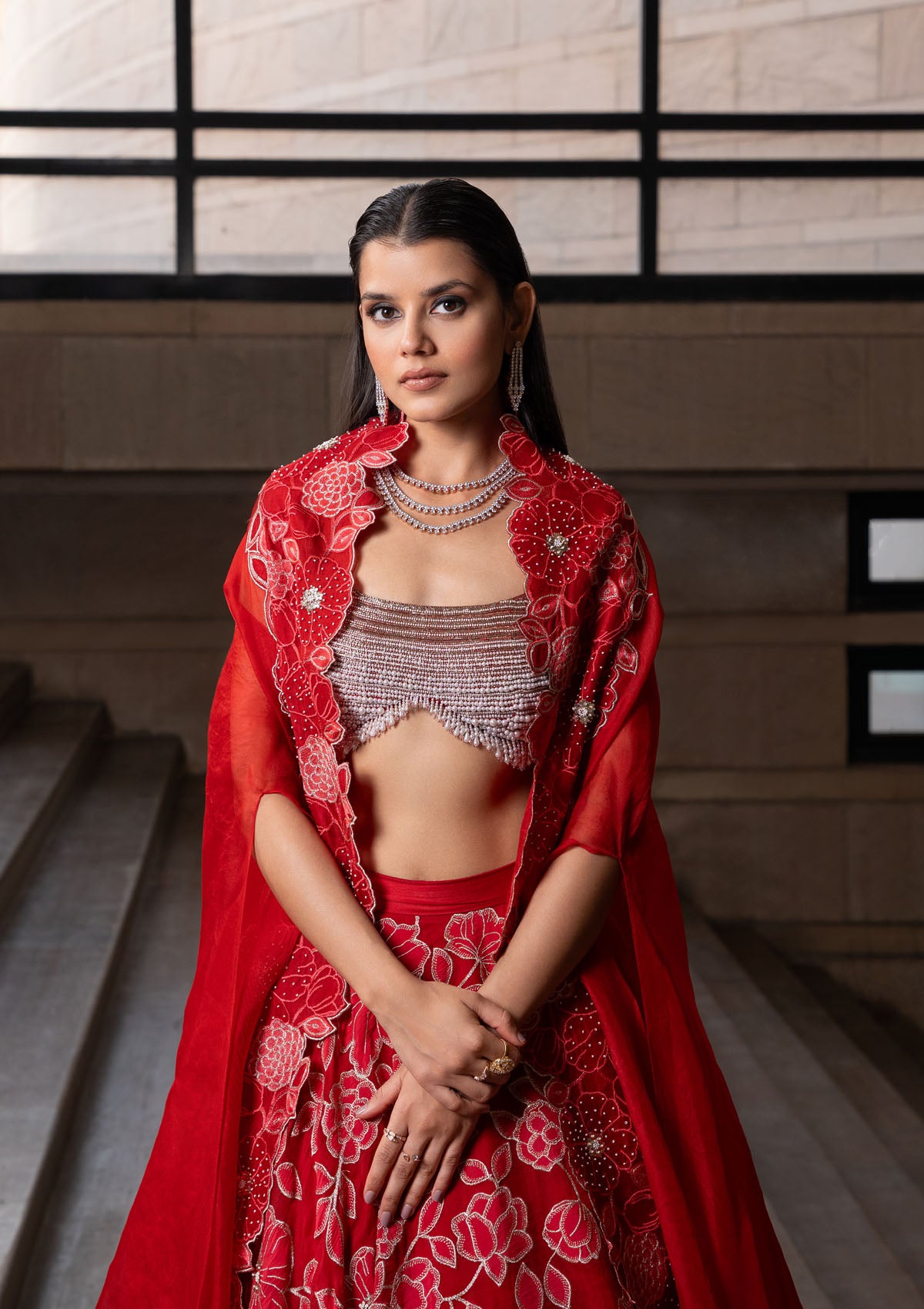 Simran Sethi in Crimson Jaal Cape and Lehenga Set