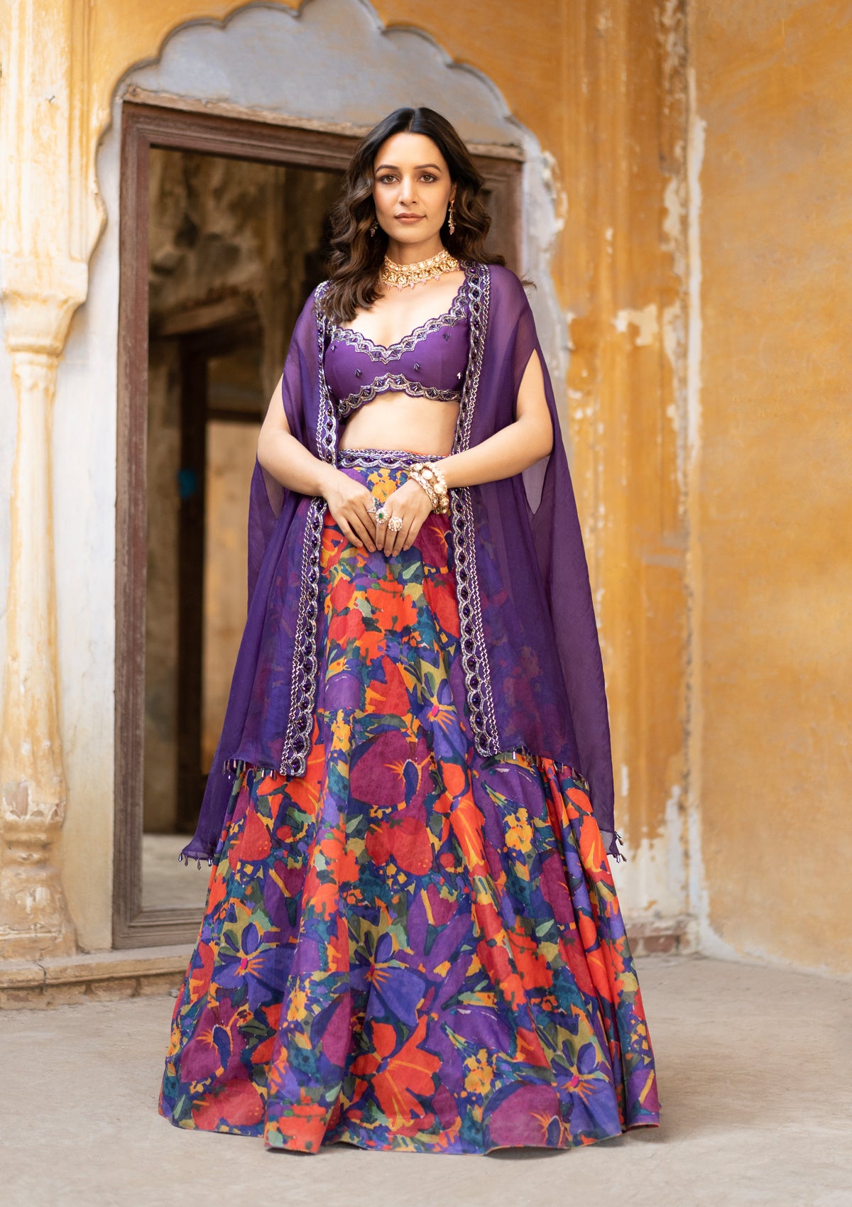 One shoulder Cape with Button Down Lehenga | Vogue India